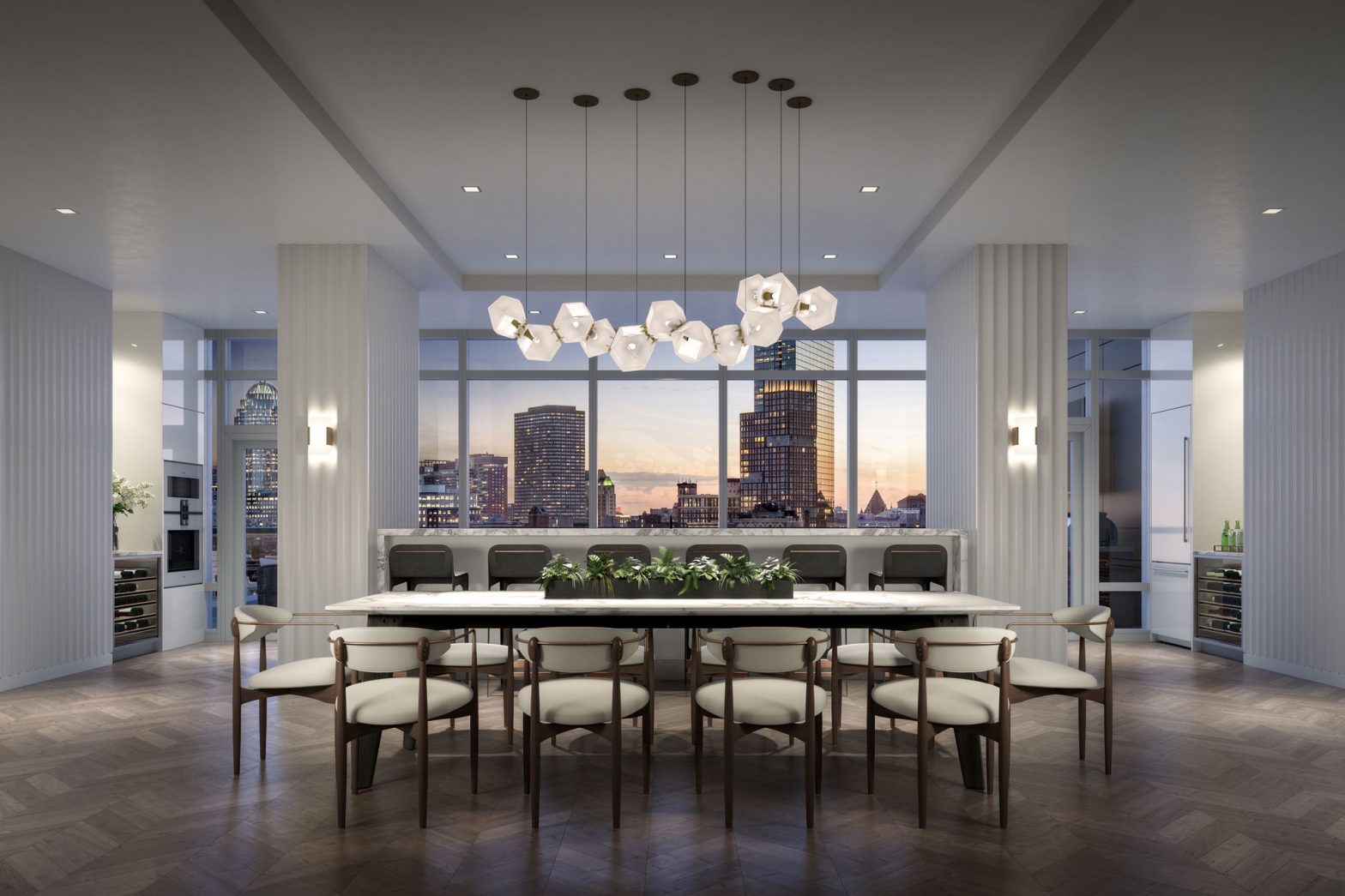 Tall white table with 10 chairs in lounge area with more seating behind it, with views of downtown Boston in 100 Shawmut's public spaces