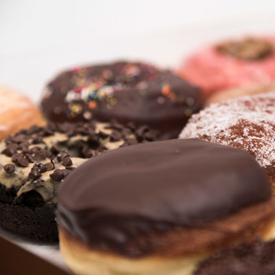 Close up of several artisanal doughnuts